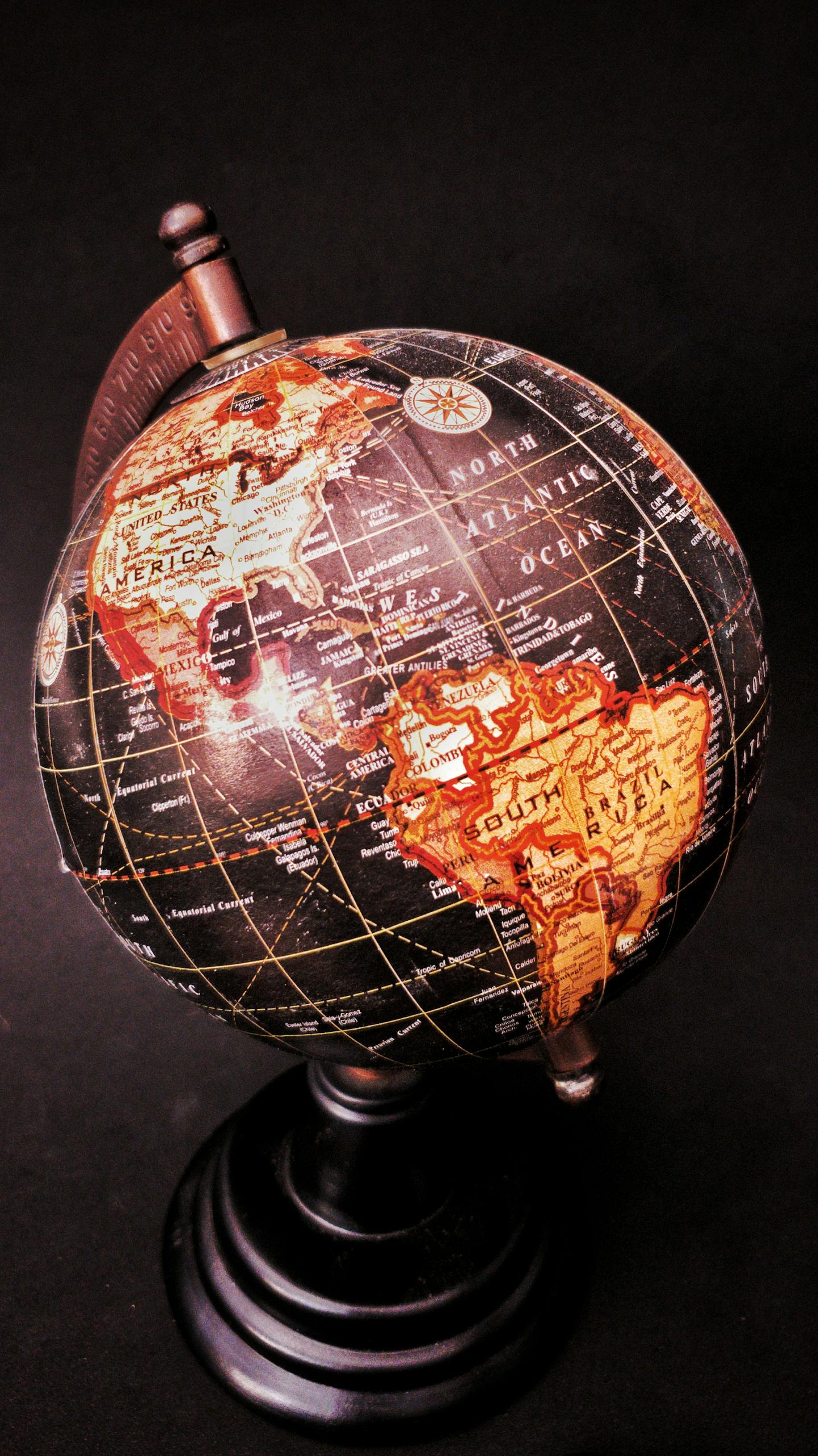 Close-up of a vintage globe showcasing the Americas with a dark backdrop.